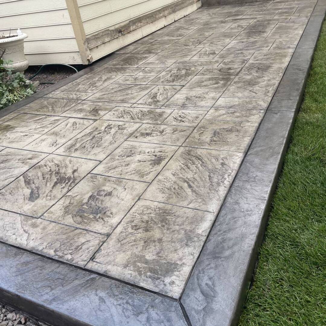 Gray slate-pattern stamped concrete walkway