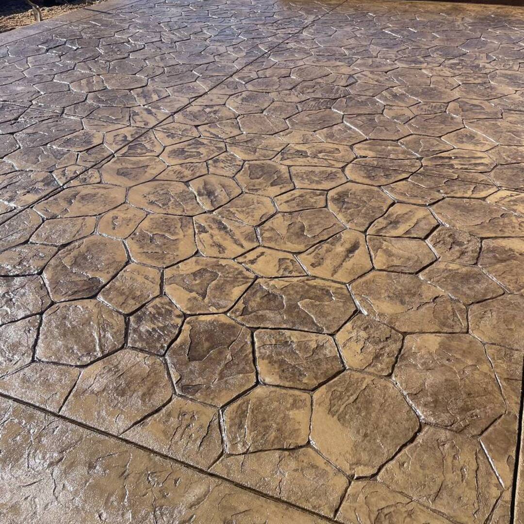 Sand-toned stone-pattern stamped concrete